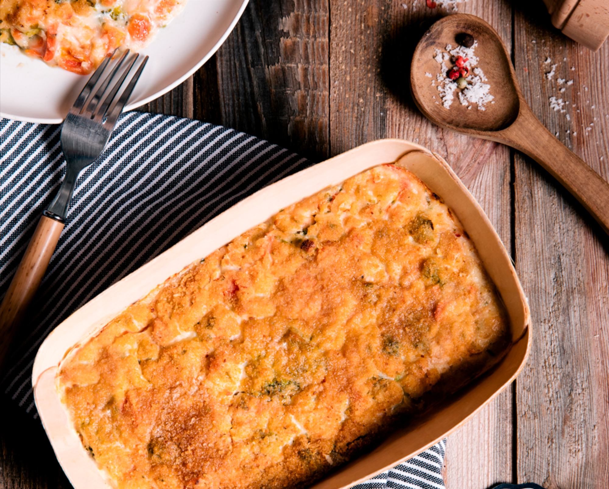 Gratin aux deux saumons, pommes de terre et petits légumes